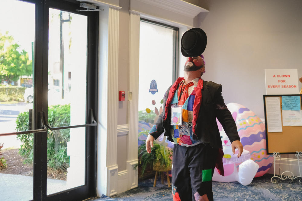 Charles Lauder balancing a hat at the World Clown Association Convention in Orlando, Florida on March 20, 2023.