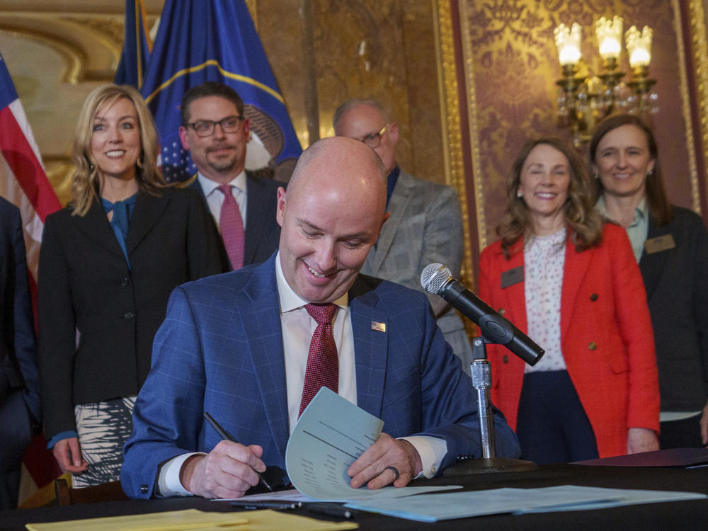 Gov. Spencer Cox signs two social media regulation bills during a ceremony at the Capitol building in Salt Lake City on Thursday, March 23, 2023. Cox signed a pair of measures that aim to limit when and where children can use social media and stop companies from luring kids to the sites.