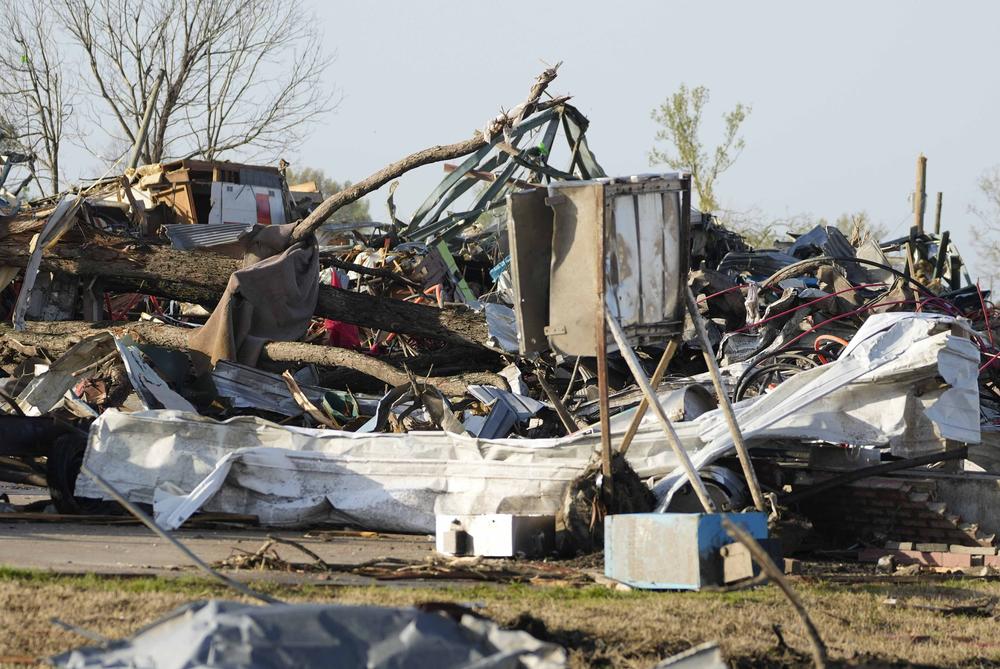 Piles of debris, insulation, damaged vehicles and home furnishings are all that remain this neighborhood in Rolling Fork, Miss.