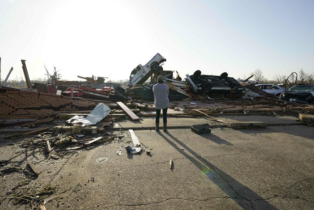 Tracy Hardin, who with her husband Tim, own Chuck's Dairy Bar, surveys the tornado destruction to their business.