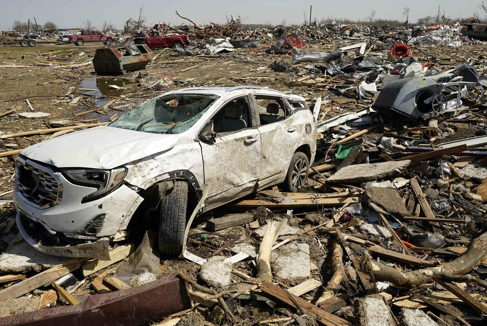 A vehicle awaits removal Saturday March 25, 2023, after getting destroyed by a Friday night tornado that hit Rolling Fork, Miss.