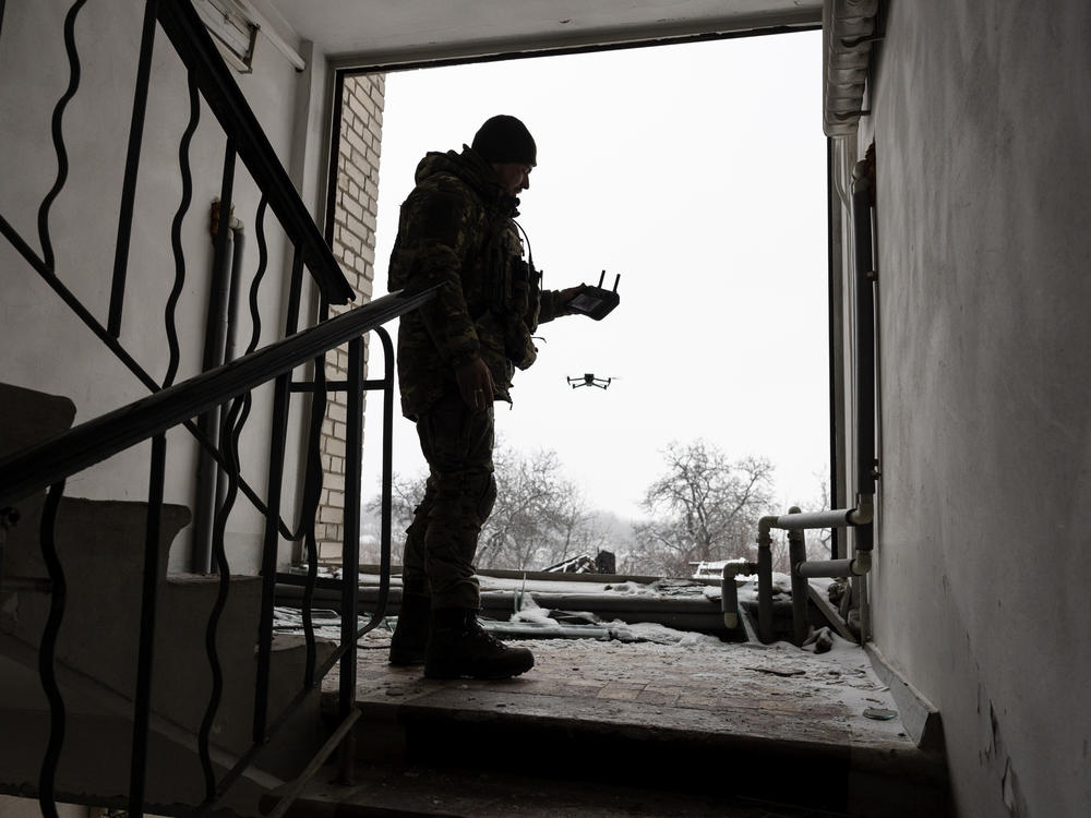 A Ukrainian soldier launches a DJI Mavic 3 drone in Bakhmut, Ukraine, near the frontline with Russian troops on Feb. 18. Ukrainian forces have been using drones for reconnaissance and directing artillery fire. But the Ukrainians have also modified them to conduct attacks on Russian ground forces.