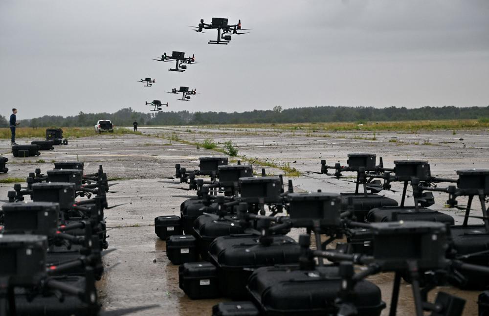 Ukrainians test Chinese-made DJI Matrice 300 reconnaissance drones in the Kyiv region on Aug. 2, 2022. The aircraft are part of Ukraine's 'Army of Drones' program. The Ukrainian Air Force is much smaller than Russia's, but Ukraine has been able to acquire relatively cheap, easy-to-use commercial drones for both reconnaissance and attacks. The DJI drones made in China are the most popular.