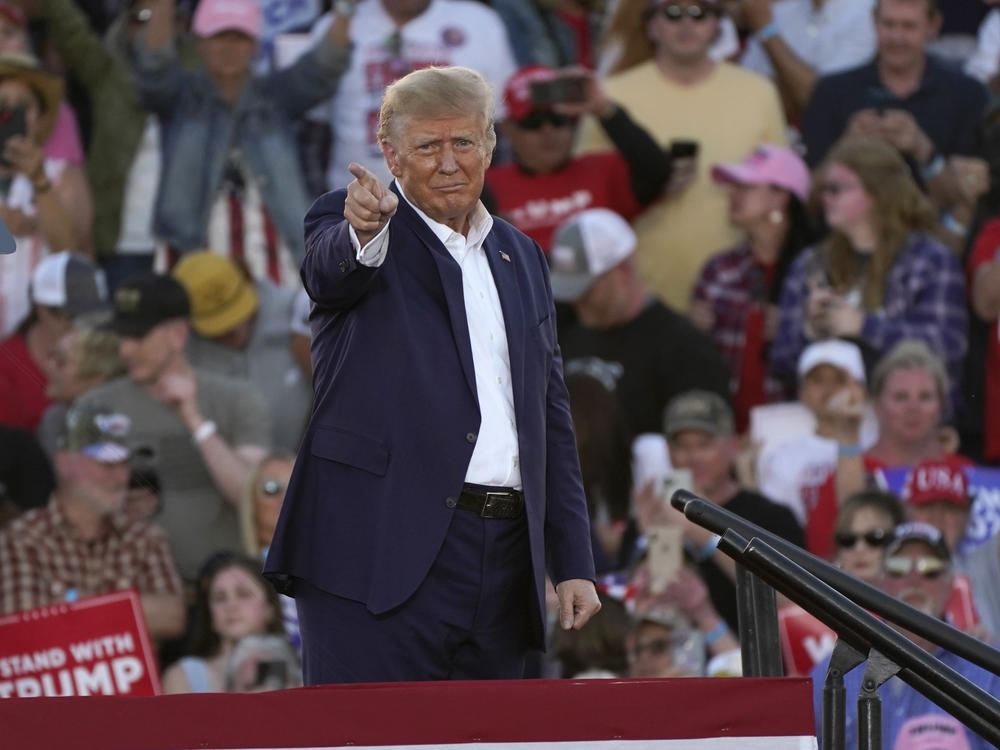 Former President Donald Trump gestures to supporters after speaking at a campaign rally at Waco Regional Airport on Saturday in Waco, Texas.