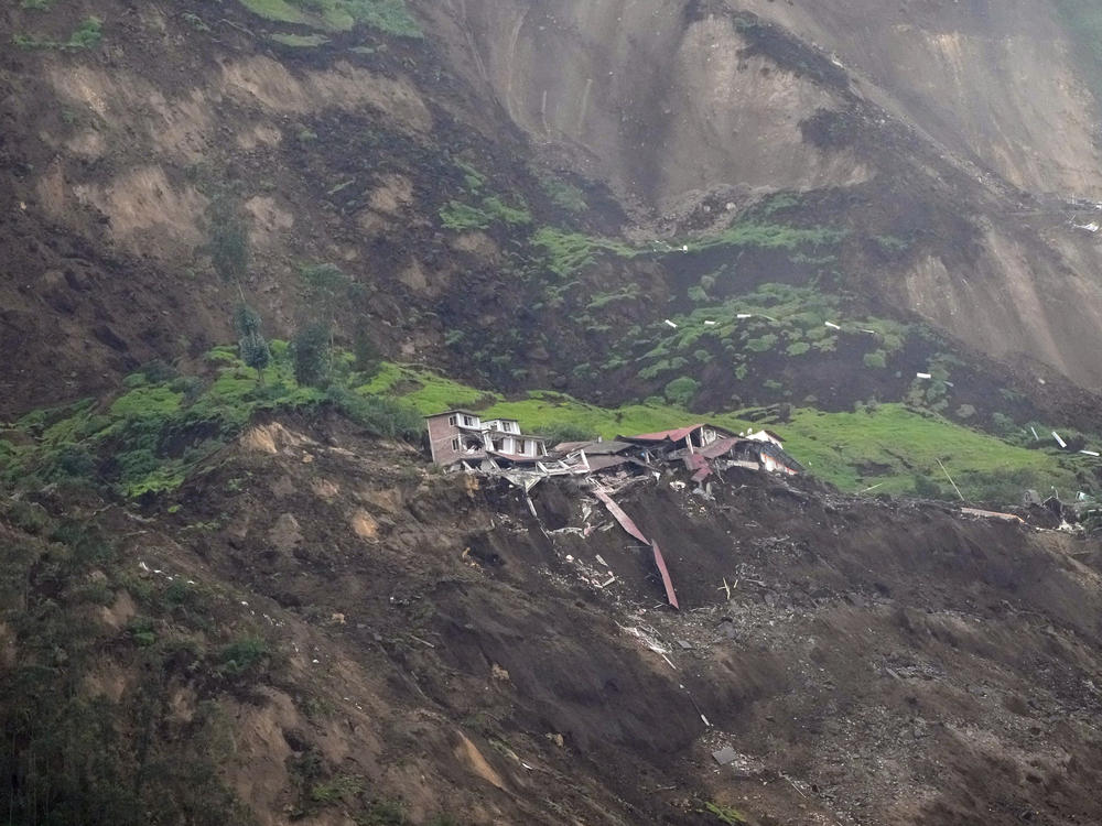 Homes are destroyed after a deadly landslide that buried dozens of homes in Alausi, Ecuador, pictured on Monday.