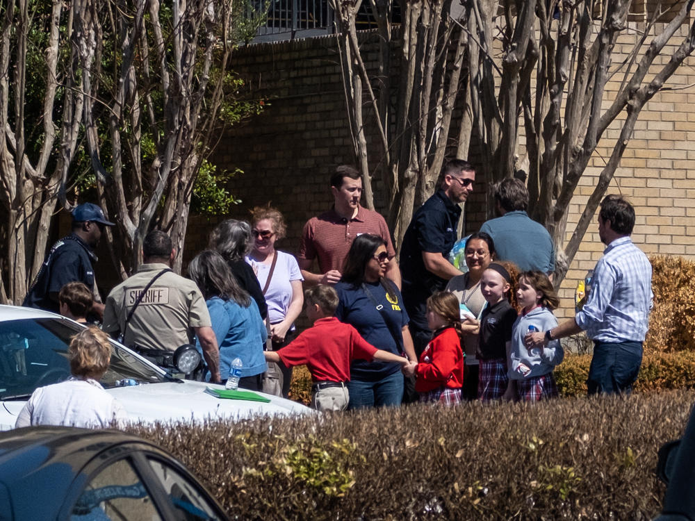 Children arrive at Woodmont Baptist Church to be reunited with their families after a mass shooting at The Covenant School on Monday in Nashville.
