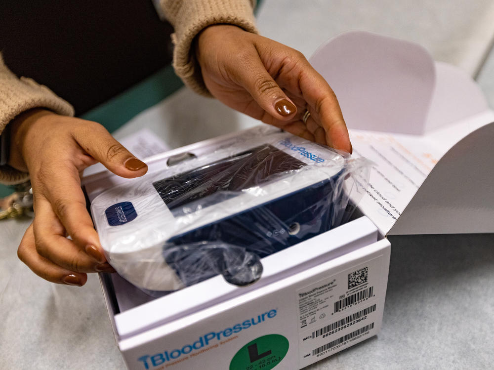 A cellular blood pressure monitoring system in its packaging. The monitor sends the data from each reading directly to Boston Medical Center for health workers to review.
