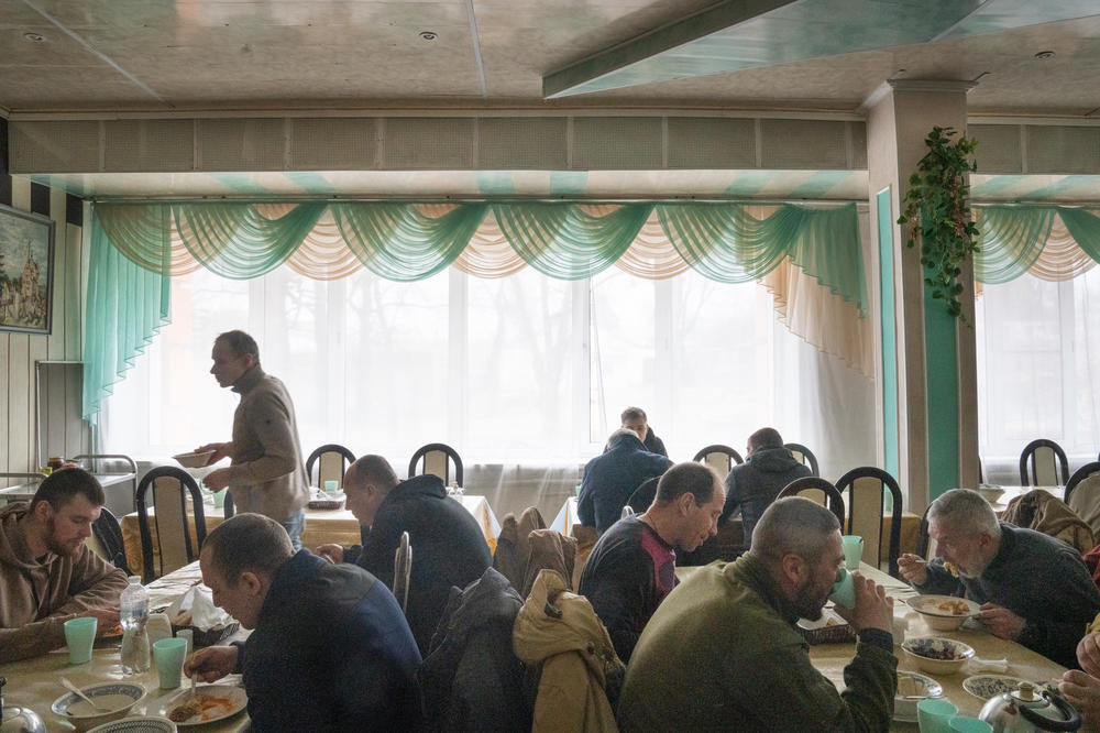 The dining hall is filled with soldiers at lunch at a rehabilitation course in northeastern Ukraine.
