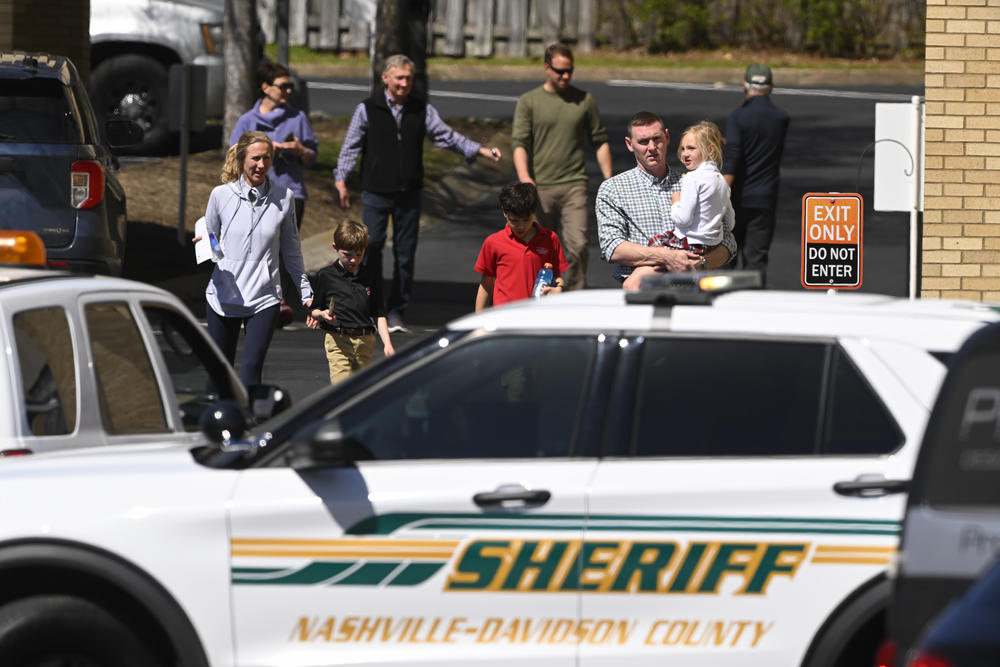 Families leave a reunification center in Nashville on Monday after three children and three adults were killed in a shooting at the Covenant School.