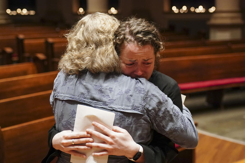 Clergy members embrace during a community vigil at Belmont United Methodist Church in the aftermath of the school shooting in Nashville on Monday.
