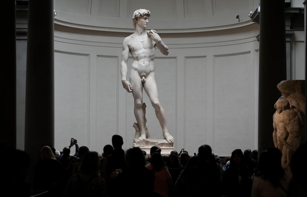 Visitors stand in front of Michelangelo's David statue in the Galleria dell'Accademia in Florence, Italy, on Tuesday. A Florida school principal was forced to resign following parental complaints that an image of the nude Renaissance masterpiece was shown to a sixth-grade art class.