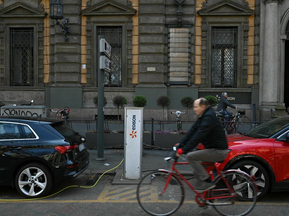 Electric cars charge at a hub in downtown Milan on March 23. Starting in 2035, all cars sold in the European Union will be zero-emission vehicles.