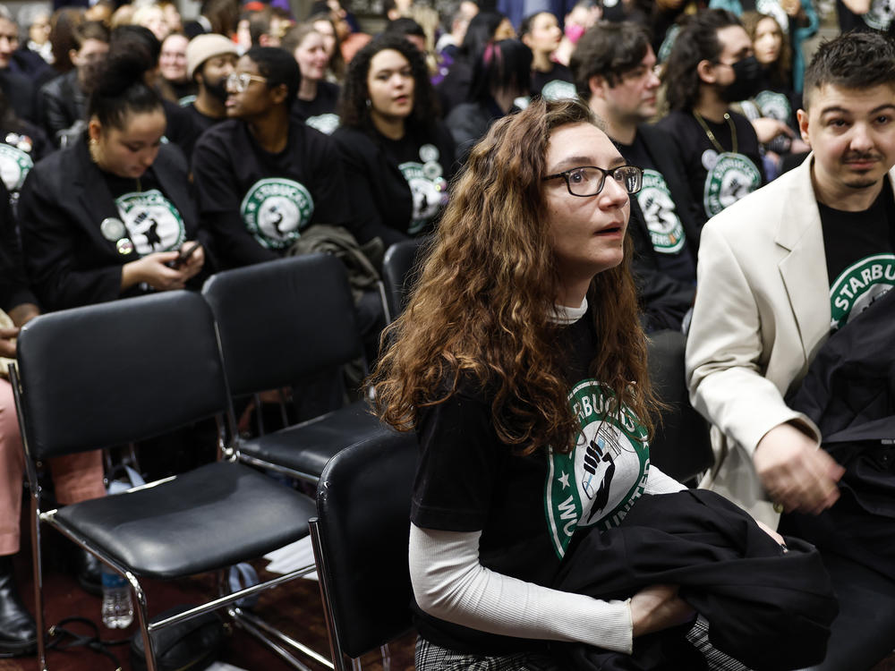 Activists with Starbucks Workers United await the start of a hearing with the Senate Health, Education, Labor, and Pensions Committee featuring former Starbucks CEO Howard Schultz on Capitol Hill on March 29, 2023.