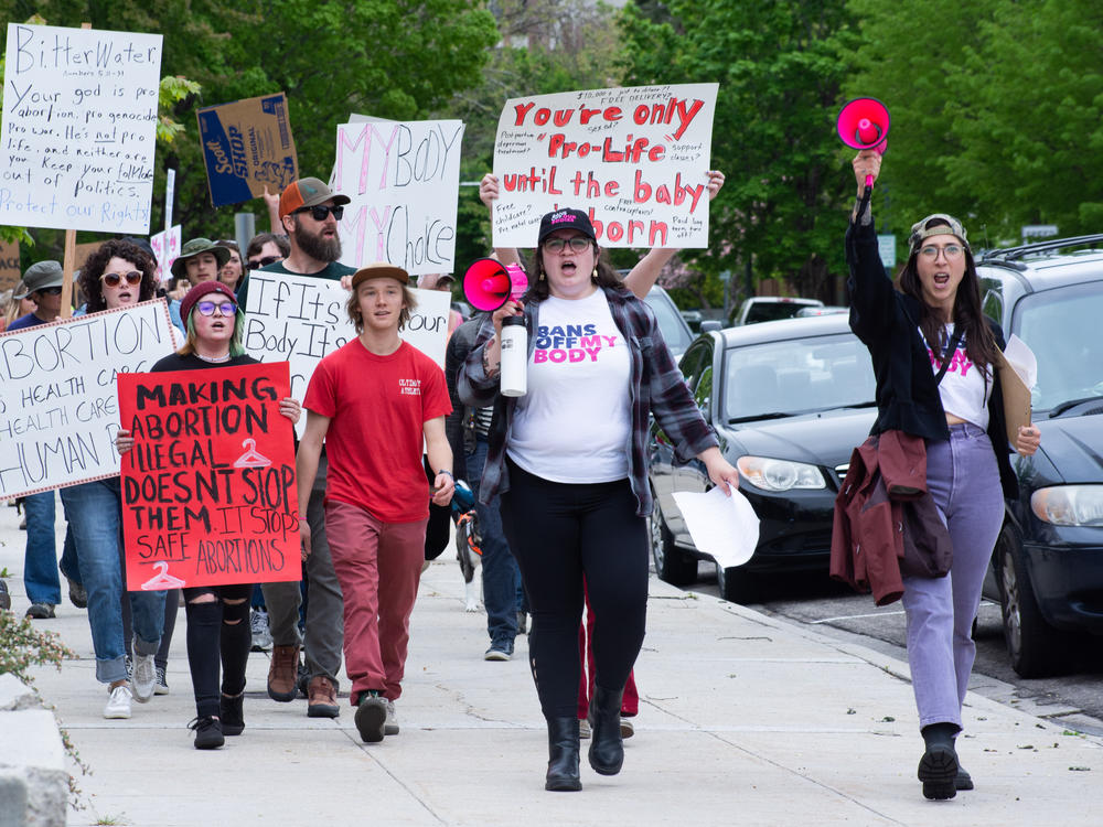 Pro-abortion rights advocates march in Boise, Idaho following the publication of a leaked U.S. Supreme Court draft opinion to overturn <em>Roe v. Wade</em> in May 2022.