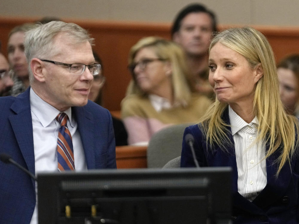 Gwyneth Paltrow and her attorney Steve Owens smile after the reading of the verdict in her lawsuit trial on Thursday in Park City, Utah.