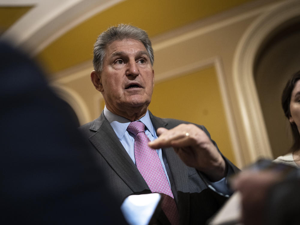 Sen. Joe Manchin speaks with reporters at the U.S. Capitol in Washington, D.C., on March 22, 2023. Manchin was a critical vote in passing President Biden's massive climate bill, but he's expressed frustration with the implementation of electric vehicle components.
