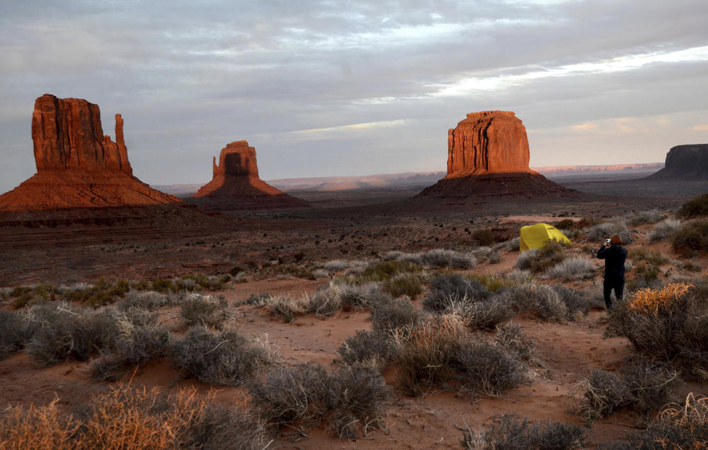 Visitors at Monument Valley Tribal Park turned out on Wednesday to watch as the West Mitten Butte cast a shadow over the East Mitten Butte.