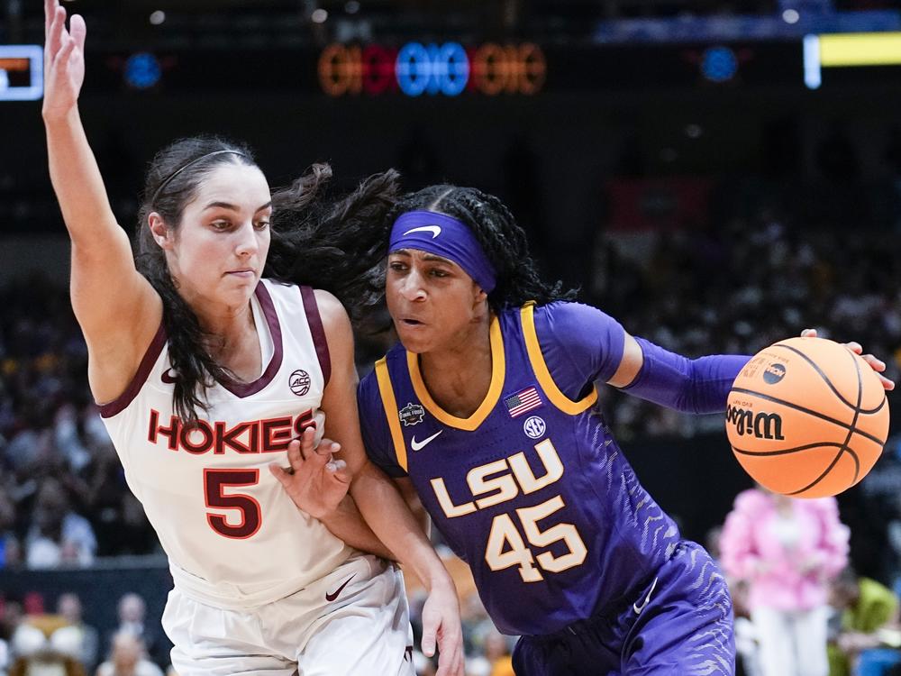 LSU's Alexis Morris drives past Virginia Tech's Georgia Amoore during the first half of an NCAA Women's Final Four semifinals basketball game Friday in Dallas.