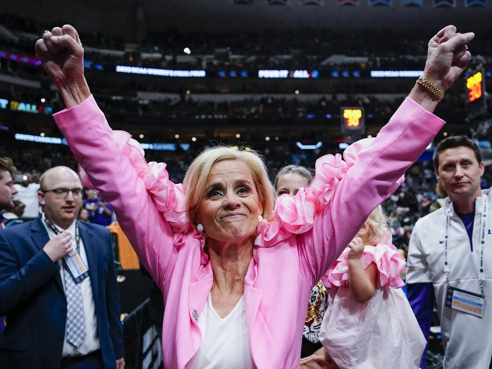 LSU head coach Kim Mulkey celebrates after her team's victory in the NCAA Women's Final Four semifinal against Virginia Tech on Friday in Dallas.