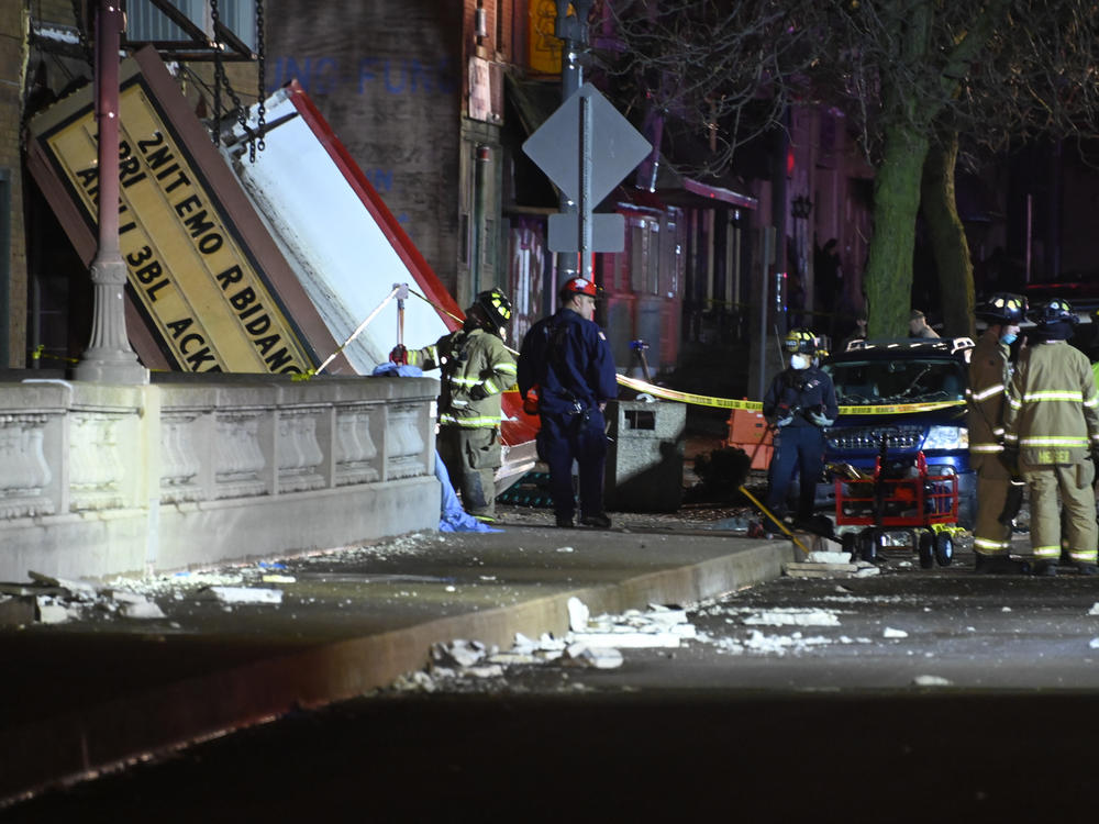 Authorities work the scene at the Apollo Theatre in Belvidere, Ill., after a severe storm hit during a heavy metal concert, killing one person and injuring 28.