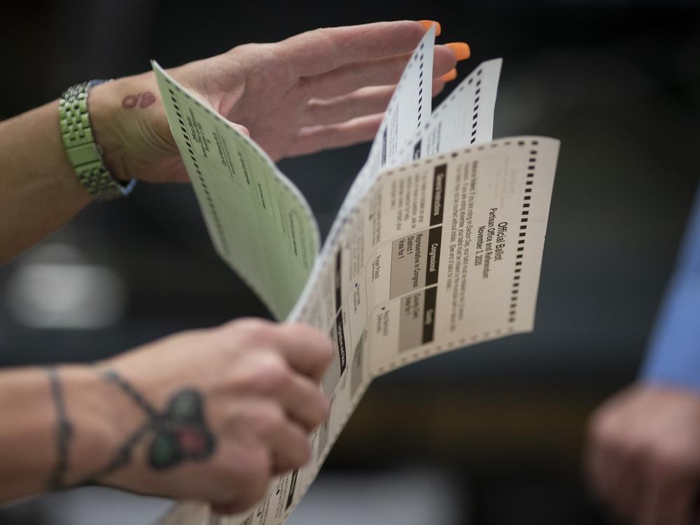 Poll workers sort out early and absentee ballots at a municipal building in Kenosha, Wis., on Election Day, Nov. 3, 2020. The April 4 election will determine majority control of the state Supreme Court.