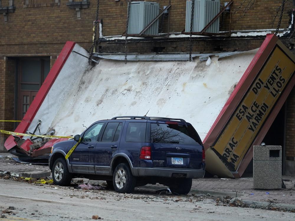 The marquee of the Apollo Theatre is down at the scene where the roof of the theatre collapsed during a tornado in Belvidere, Ill. Belvidere Fire Chief Shawn Schadle said 260 people were in the venue for a concert.