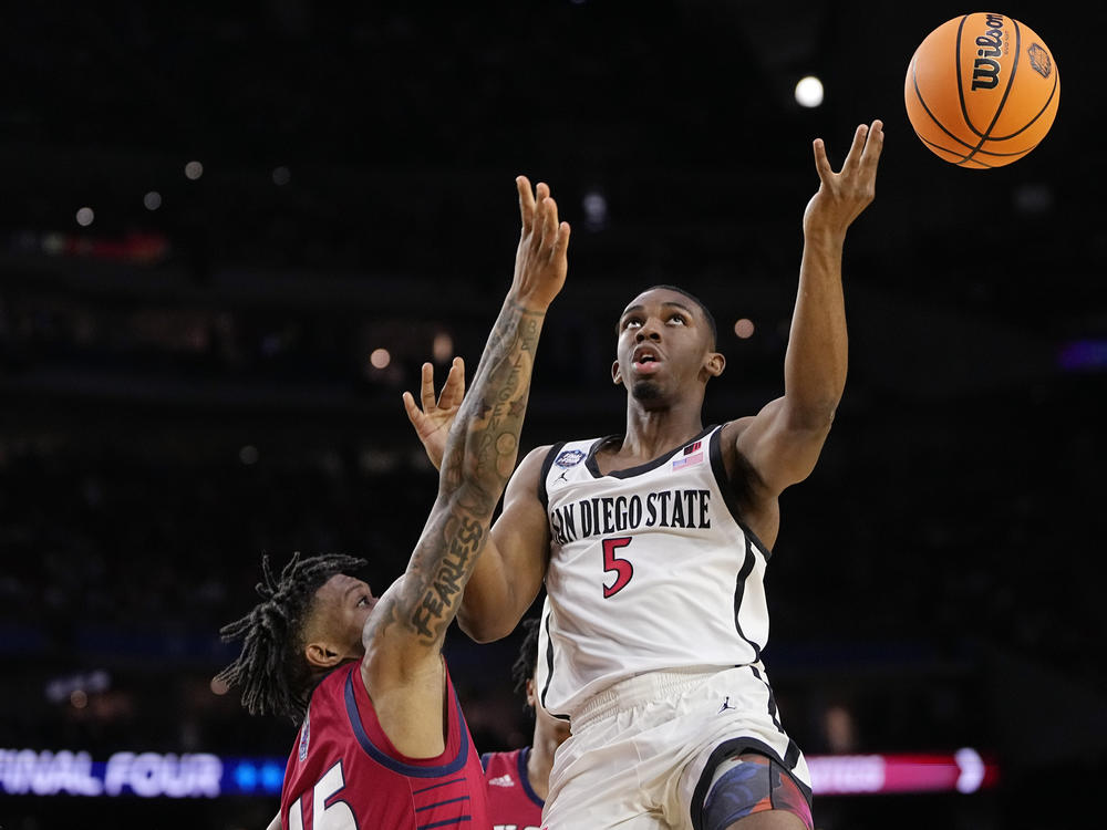 San Diego State guard Lamont Butler shoots over Florida Atlantic guard Alijah Martin during the second half of a Final Four college basketball game in the NCAA Tournament on Saturday, April 1, 2023, in Houston.