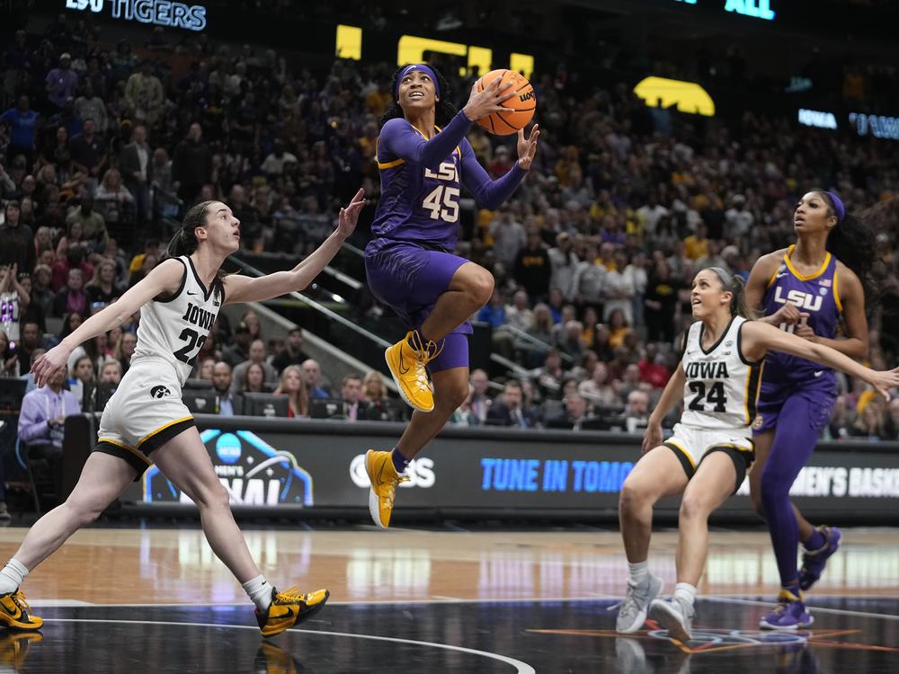 LSU's Alexis Morris shoots past Iowa's Caitlin Clark during the second half of the NCAA Women's Final Four championship basketball game Sunday in Dallas.