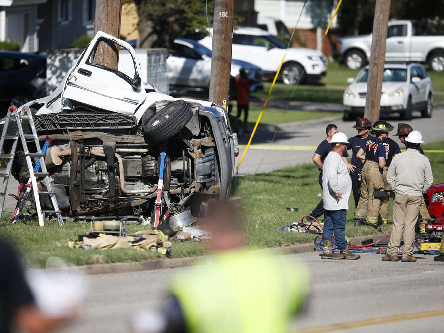 Emergency workers work the scene of a fatal car accident in August 2021 in Tulsa, Okla. Nearly 43,000 people died in U.S. traffic crashes in 2021, with deaths due to speeding and impaired or distracted driving on the rise.