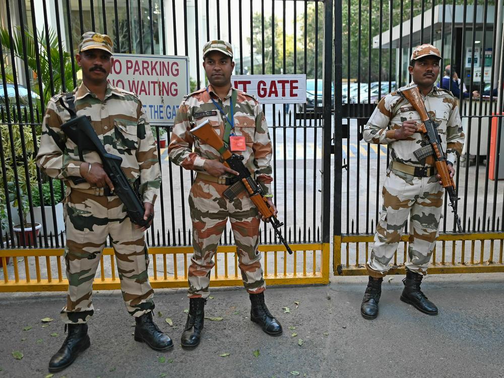 Border Police stand guard outside the office building where Indian tax authorities raided the BBC's office in New Delhi on Feb. 15.