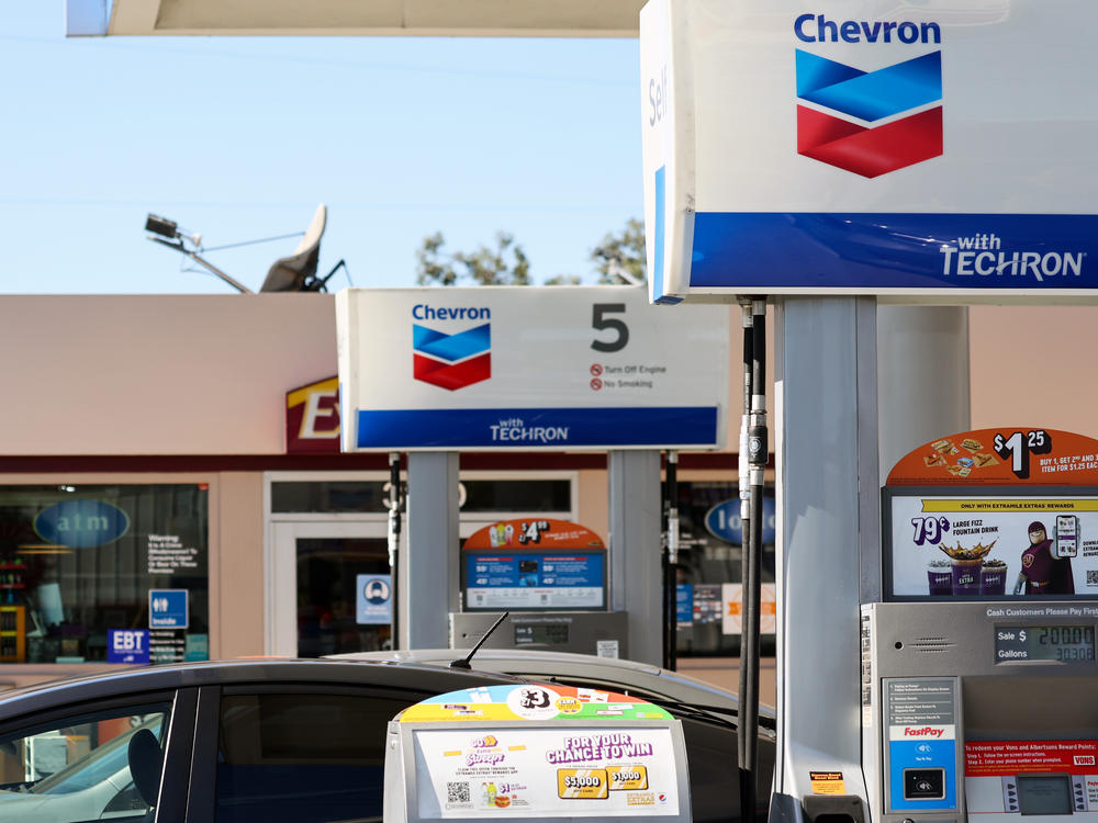 The Chevron logo is displayed at a gas station in Los Angeles on Oct. 28, 2022. Saudi Arabia's oil production cut will financially benefit the kingdom, but U.S. energy companies will benefit too.