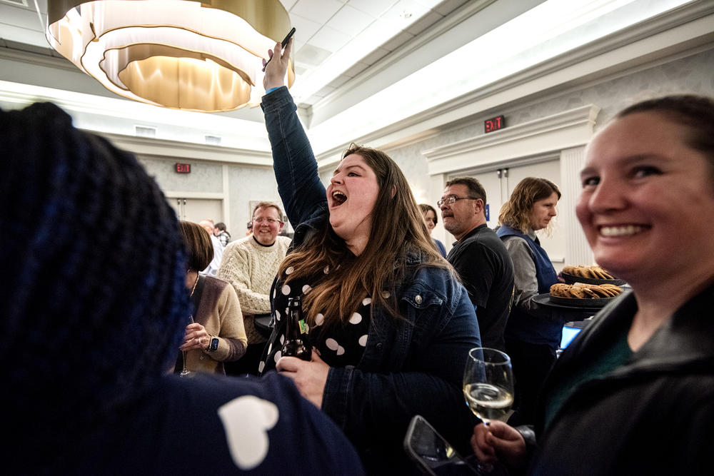 Attendee Jenna Proudfit shouts to alert the room that the Wisconsin Supreme Court race had been called for Judge Janet Protasiewicz on Tuesday, April 4, 2023, in Milwaukee, Wis.