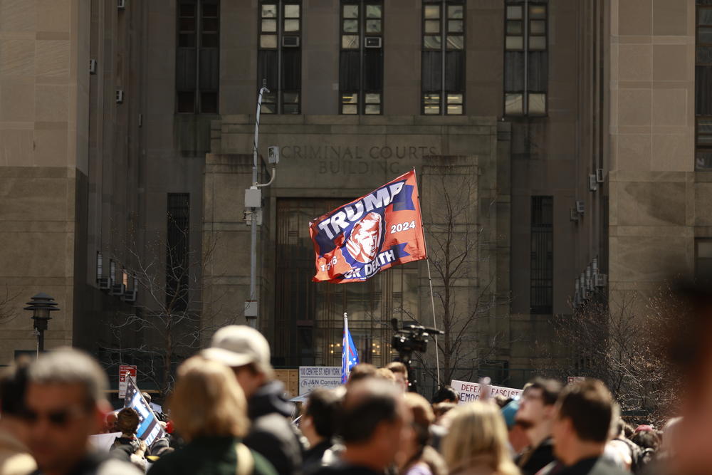 The entrance of Manhattan Criminal Courts Building fills with commotion from supporters of the former president as Donald J. Trump makes his way to his scheduled surrender at the Manhattan Criminal Courts Building in Manhattan, New York City.