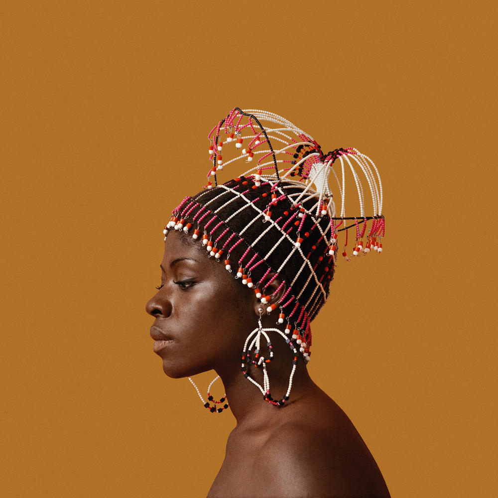 Kwame Brathwaite, Sikolo Brathwaite wearing a headpiece designed by Carolee Prince, African Jazz-Art Society & Studios (AJASS), Harlem, ca. 1968; from <em>Kwame Brathwaite: Black Is Beautiful</em> (Aperture, 2019)