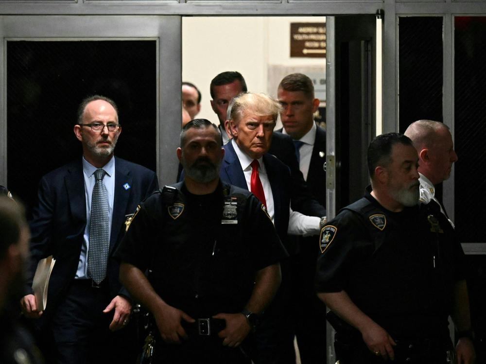 Former US President Donald Trump makes his way inside the Manhattan Criminal Courthouse in New York on April 4, 2023.