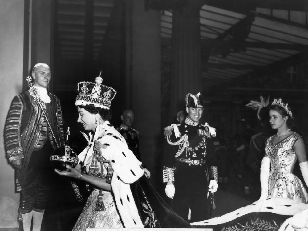 Queen Elizabeth II enters Buckingham Palace after her Coronation ceremony on June 2, 1953.