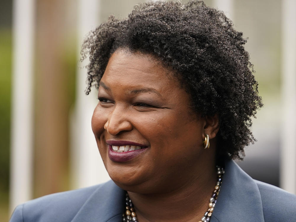 Then-Georgia Democratic gubernatorial candidate Stacey Abrams talks to the media on May 24, 2022, in Atlanta. Abrams was appointed Wednesday as Howard University's first chair for race and Black politics.