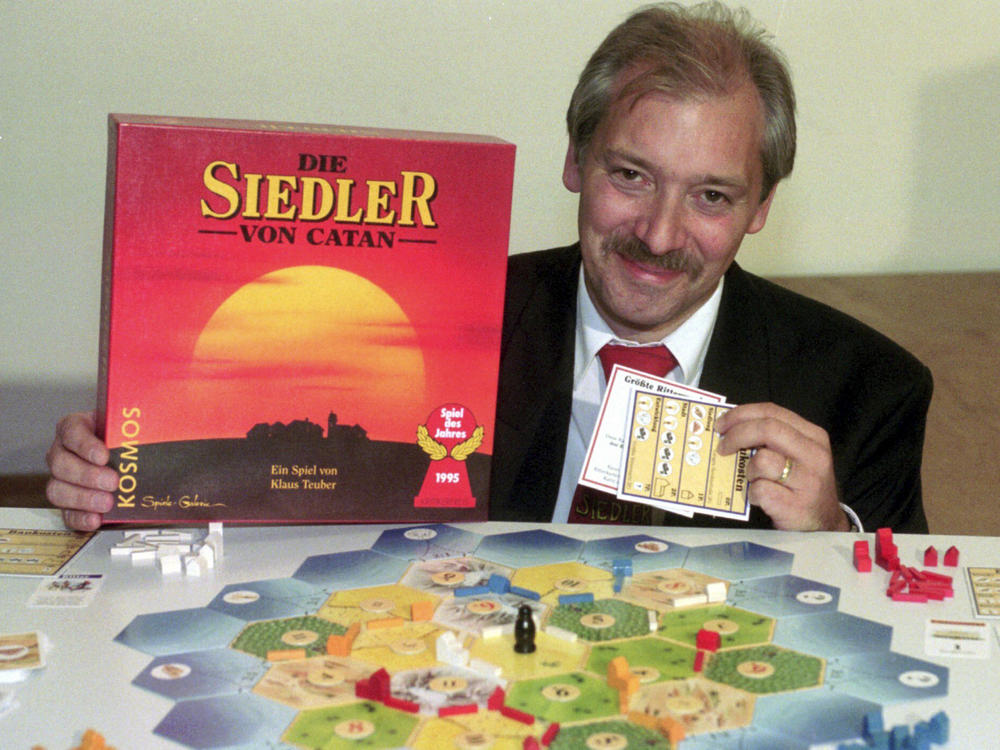 Klaus Teuber, a dental technician from Darmstadt, presents his game The Settlers of Catan on Sept. 29, 1995, in Frankfurt, Germany.