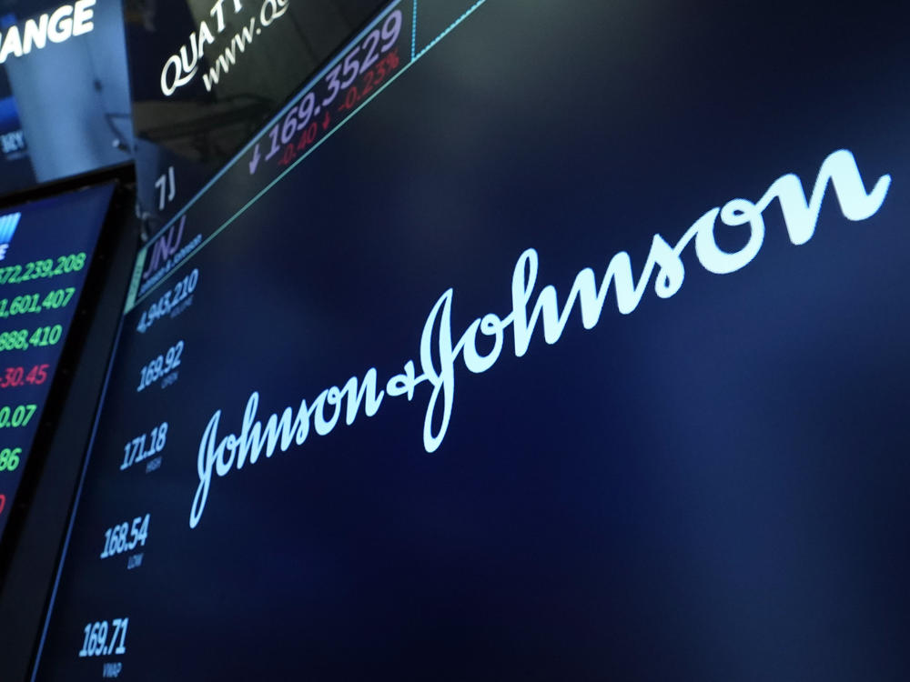 The Johnson & Johnson logo appears above a trading post on the floor of the New York Stock Exchange on July 12, 2021.
