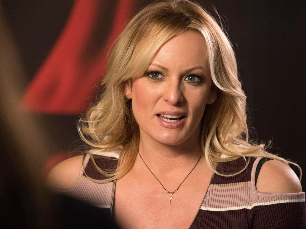 Stormy Daniels talks with a journalist in Berlin shortly after her lawyer filed a defamation case against Donald Trump on her behalf in October 2018.