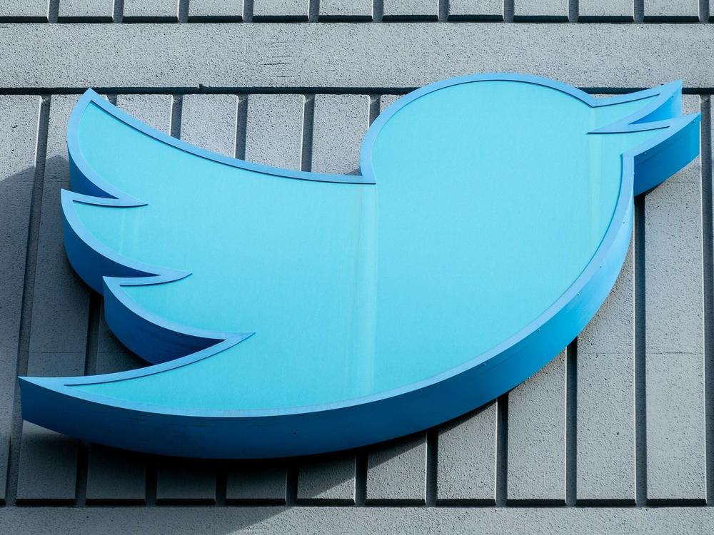 The Twitter logo is seen on a sign on the exterior of Twitter headquarters in San Francisco, California, on October 28, 2022.