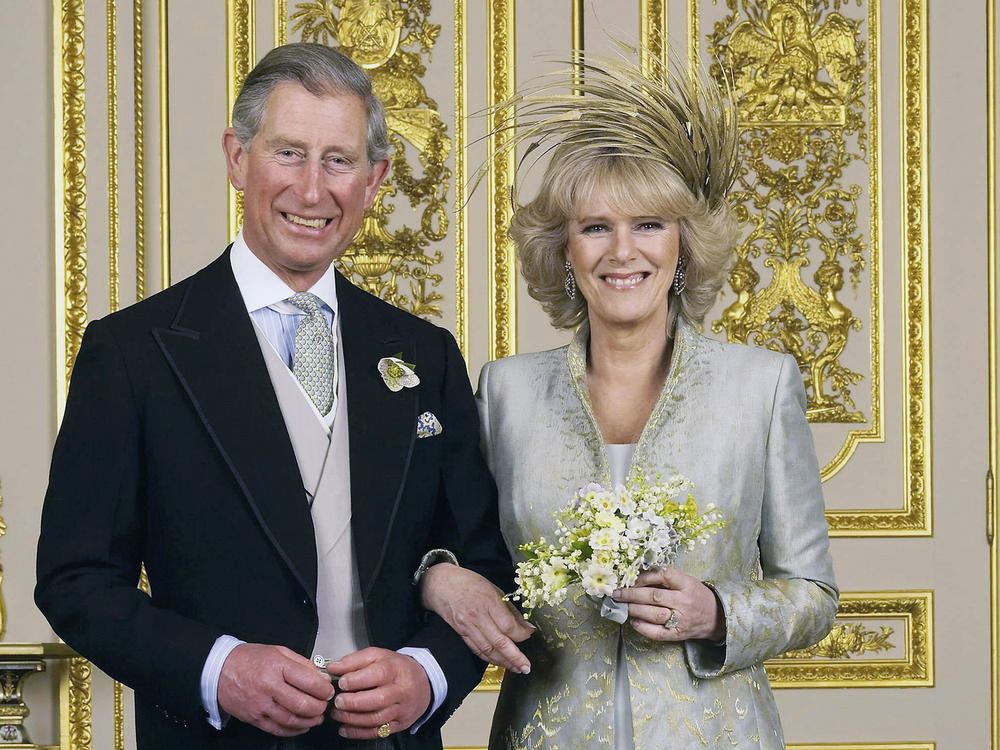 Then-Prince of Wales and Camilla, Duchess of Cornwall pose for a photo in Windsor Castle after their wedding ceremony in April 2005.