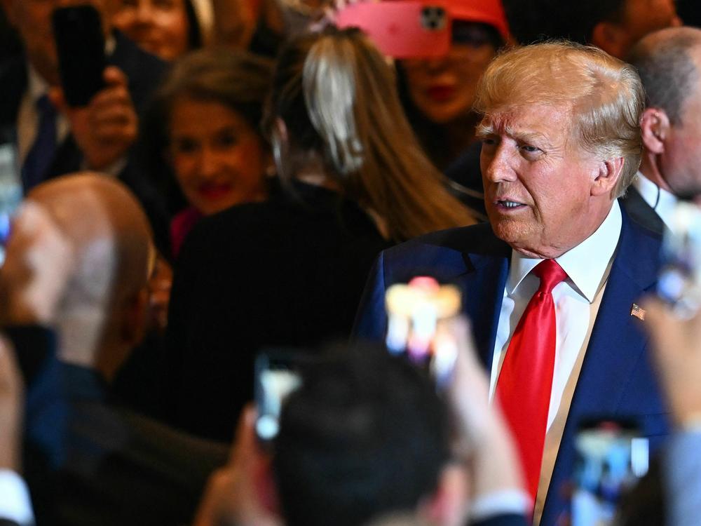 Former President Donald Trump arrives to speak at his Mar-a-Lago estate in Palm Beach, Fla., on Tuesday night, following his arraignment in New York on felony charges.