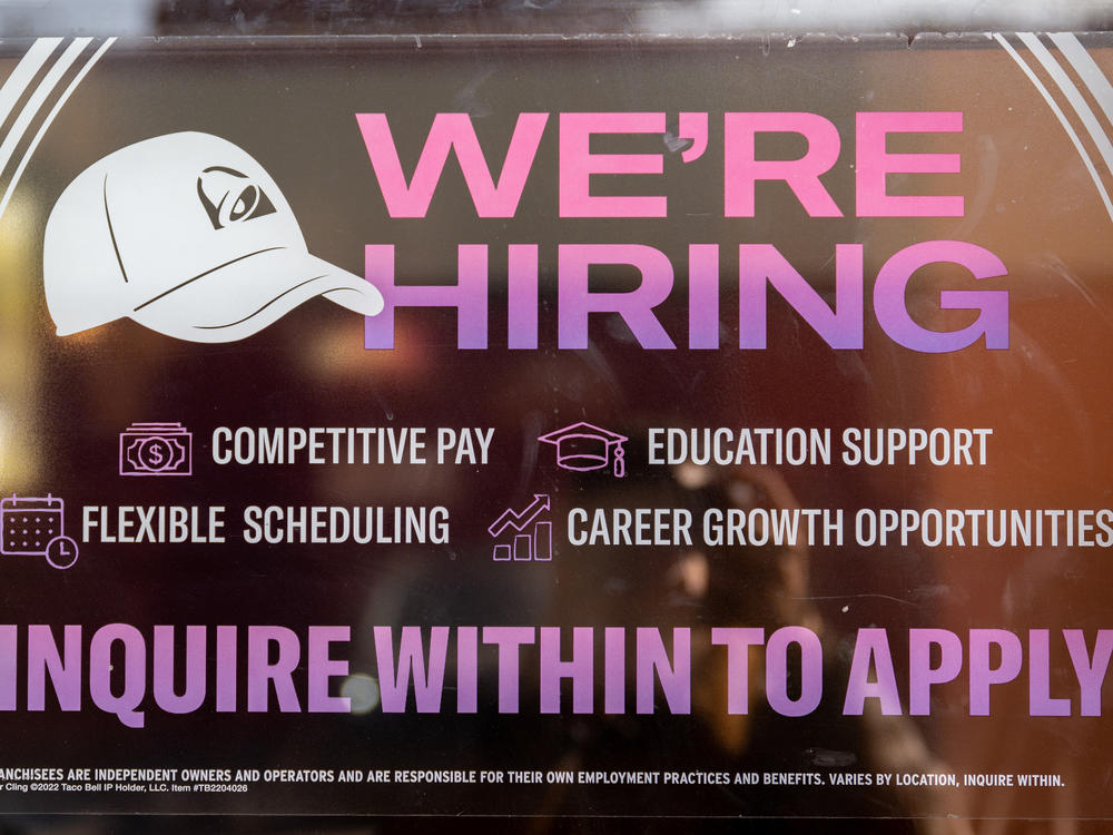 A call for employment sign is displayed at a Taco Bell in Austin, Texas, on March 10, 2023. The labor market is slowing as higher interest rates start to filter through the economy.