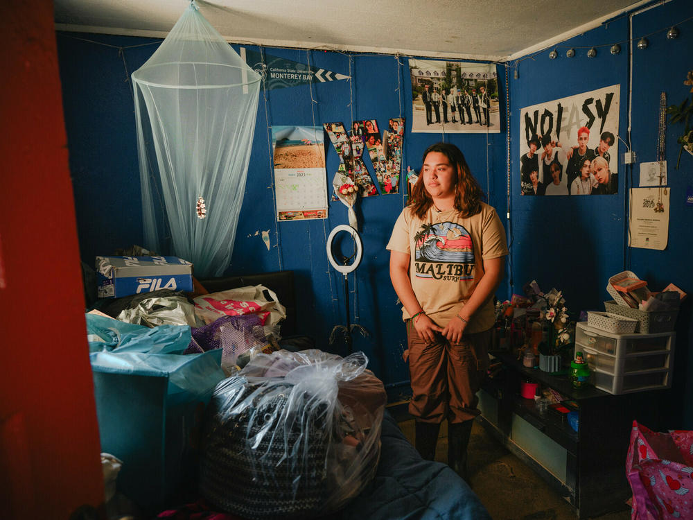 Climate activist and Pajaro Valley High School senior Denia Escutia, 18, looks around a mud-coated bedroom in Pajaro, California on March 24, 2023. Days earlier, residents began returning to their homes after a levee breach flooded the area several weeks earlier.