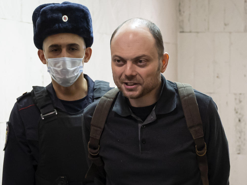 Russian opposition activist Vladimir Kara-Murza is escorted to a hearing in a court in Moscow, Feb. 8. He has been imprisoned in Moscow since April 2022 for speaking out against Russia's invasion of Ukraine.