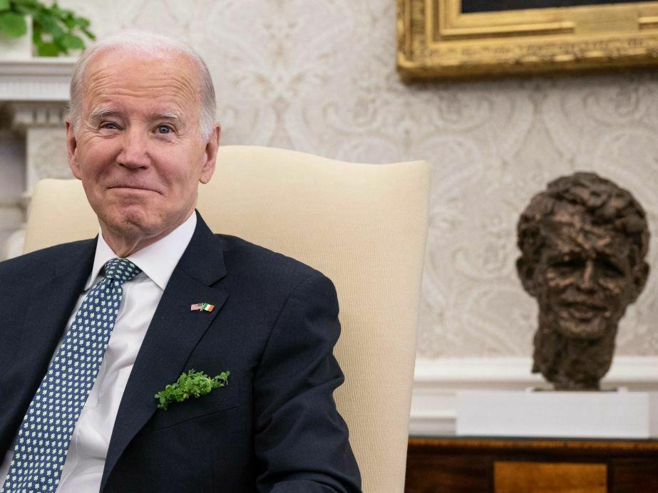 President Biden is pictured in the Oval Office on St. Patrick's Day. Biden, who is Irish Catholic, is traveling to Ireland on Tuesday.