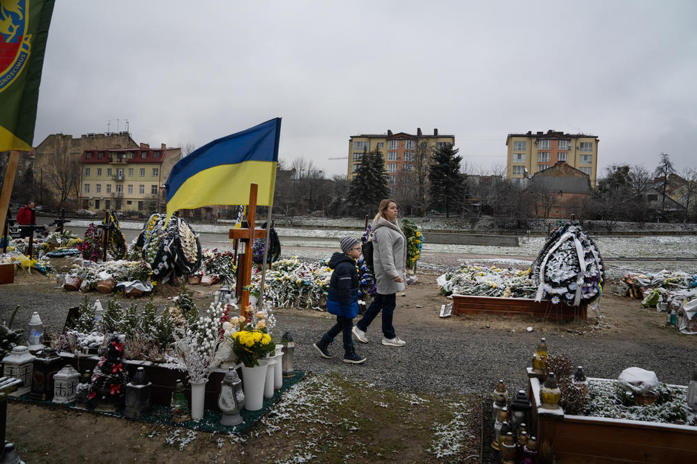 Bohdan Semenukha and his mom, Viktoria, visit the Lychakiv cemetery in Lviv to pay tribute to those who have died in this war.