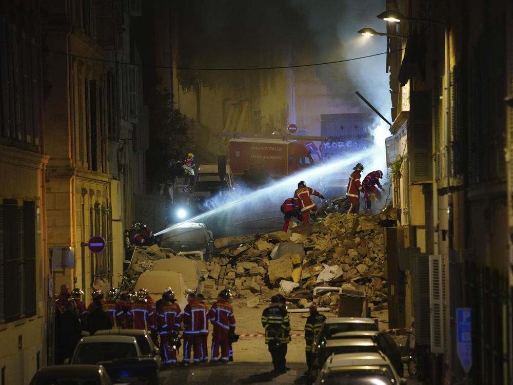 Firefighters work after building collapsed early Sunday in Marseille, southern France.
