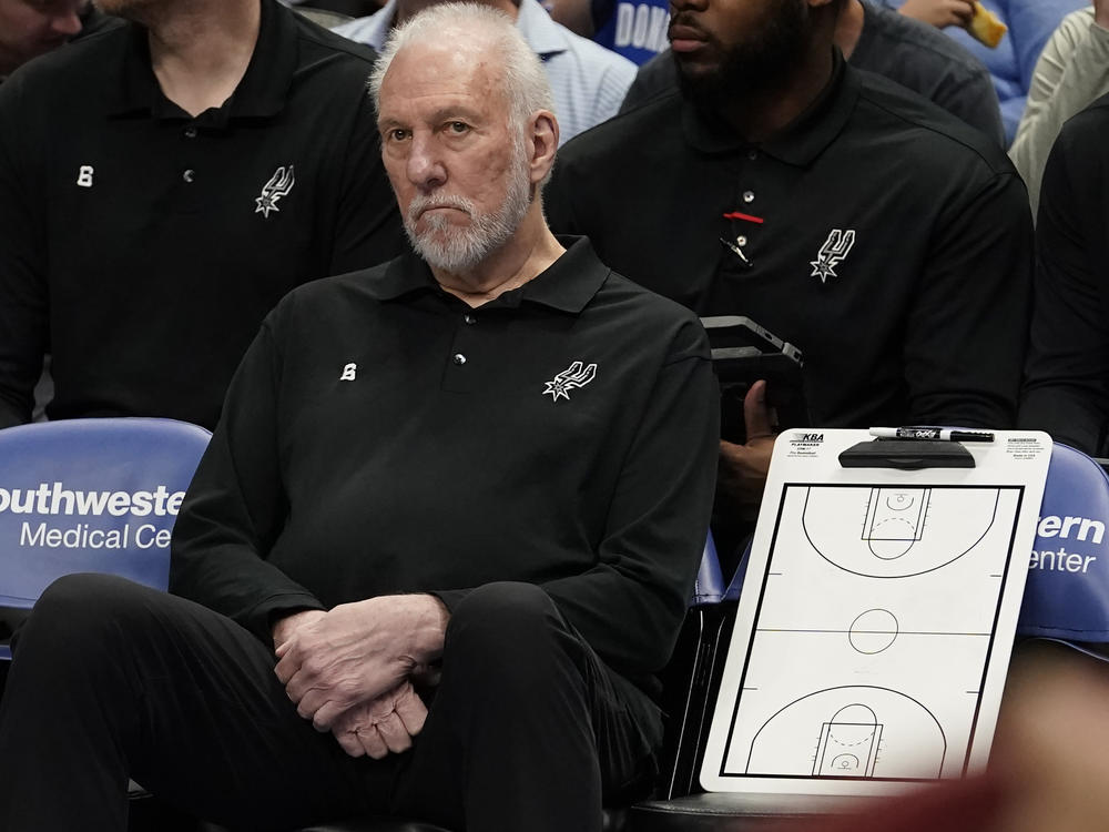 San Antonio Spurs beach coach Gregg Popovich sits on the bench during the first quarter of an NBA basketball game against the Dallas Mavericks in Dallas, Sunday, April 9, 2023.